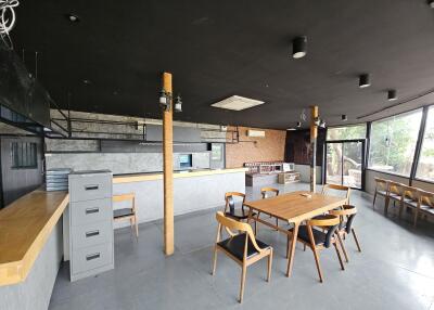 Modern kitchen area with dining table and chairs