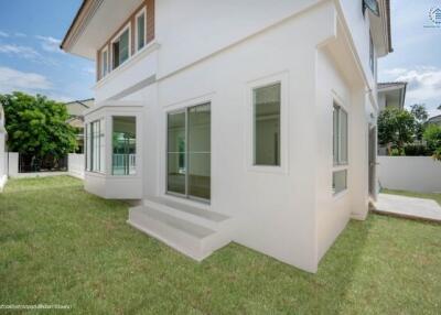 modern house exterior with green lawn