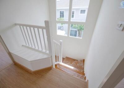 Bright stairway with window view