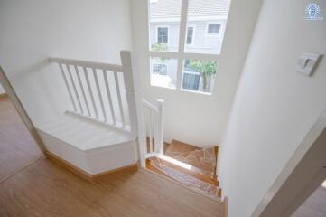 Bright stairway with window view