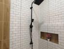 Modern shower with white subway tiles and niche