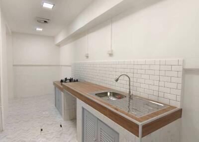 Modern kitchen with tiled backsplash and built-in appliances