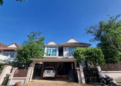 Two-story residential building with garage and driveway