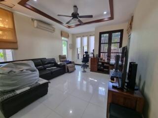 Spacious living room with modern furnishings and natural light