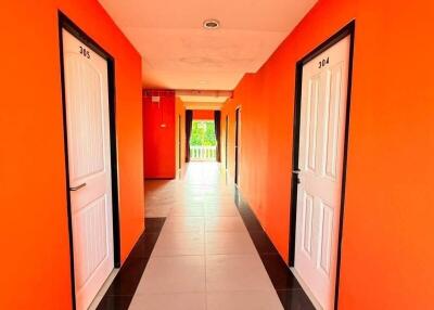 Brightly colored hallway with doors