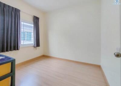 Empty bedroom with window and curtains