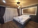modern bedroom with double bed, hanging lights, and large window