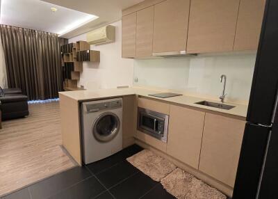 Modern kitchen with built-in appliances and wooden cabinets