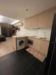 Modern kitchen with built-in appliances and wooden cabinets