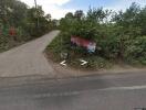 Rural road with greenery and road sign