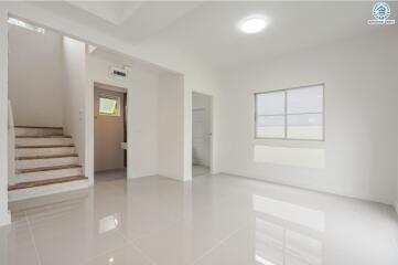 Spacious and bright living room with clean, modern design.