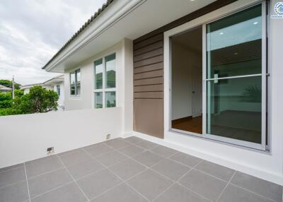 Spacious balcony area with sliding glass doors