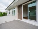 Spacious balcony area with sliding glass doors