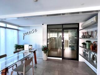 Modern office space with glass table and shelving