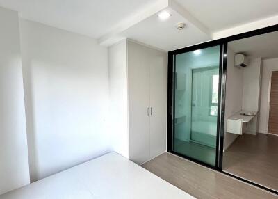 Modern bedroom with large glass sliding door