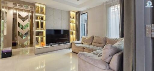 Modern living room with built-in shelving and flat-screen TV