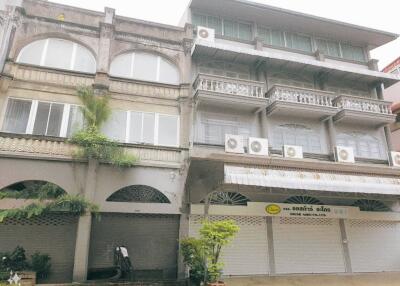 Three-story commercial building with multiple air conditioning units