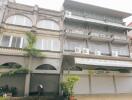 Three-story commercial building with multiple air conditioning units