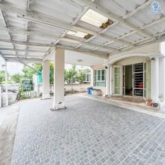 Covered garage with entrance to the house