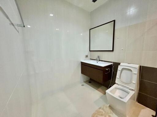 Modern bathroom with a large mirror and stylish vanity