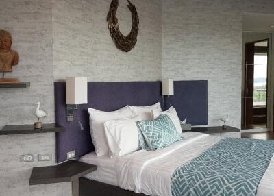 Modern bedroom with decorative accents and a comfortable bed