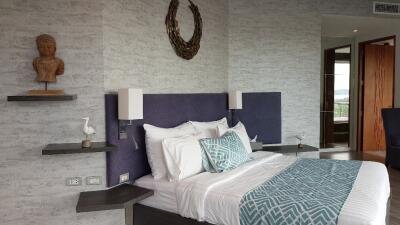 Modern bedroom with decorative accents and a comfortable bed