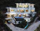 Modern multi-story house with large windows and a pool