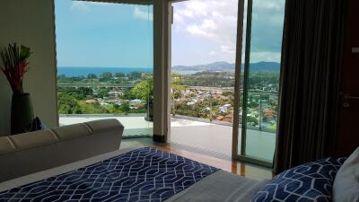 Bedroom with a scenic view and balcony access