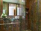 Modern bathroom with glass sink, large mirror, and tiled walls