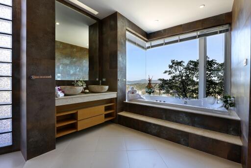 Modern bathroom with large windows and bathtub