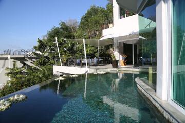 Building with pool and outdoor seating