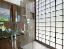 Modern bathroom with glass sink and shower