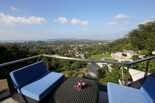 Spacious balcony with stunning view of city and mountains