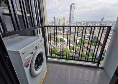 Balcony with a washing machine and city view