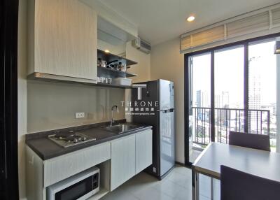 Modern kitchen with appliances and city view