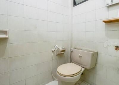 Clean, tiled bathroom with a toilet