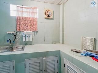 Small kitchen with window and basic fixtures