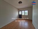 Empty bedroom with tiled flooring and window