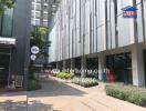 Front view of a commercial building complex with greenery