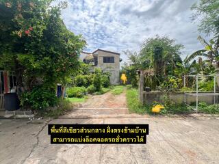 Well-maintained garden area with a pathway leading to a residential house