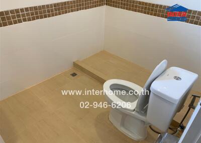 Modern bathroom with tiled floor and toilet