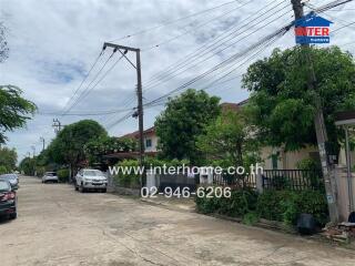 Street view with houses and parked cars