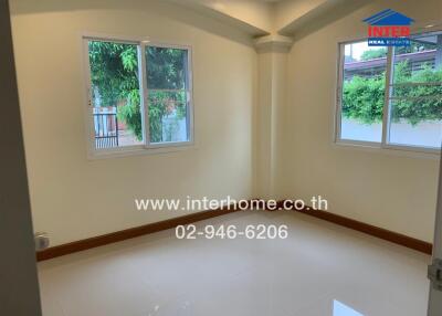 Empty bedroom with windows and shiny tile floor