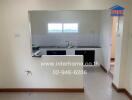 Small kitchen with a sink, countertop, and wall-mounted cabinets