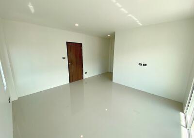 Empty room with a wooden door