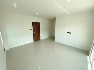 Empty room with a wooden door