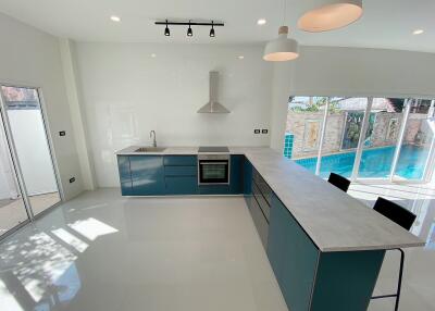 Modern kitchen with pool view