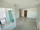 Spacious living room with large window and balcony access