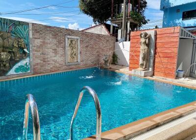 Outdoor pool with decorative elements and clear water