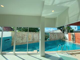 View of the pool area from inside the house